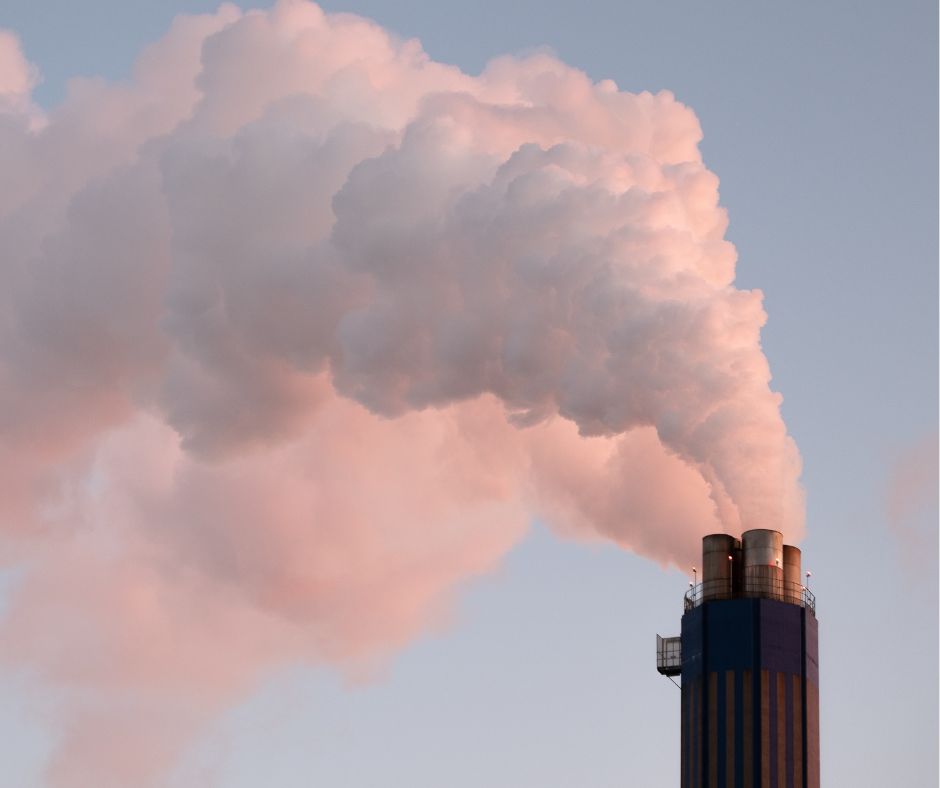 image of industry smokestack pouring smoke into the air meant to symbolize the coke ovens in Gary Indiana that pollute the air in the Northwest Indiana region